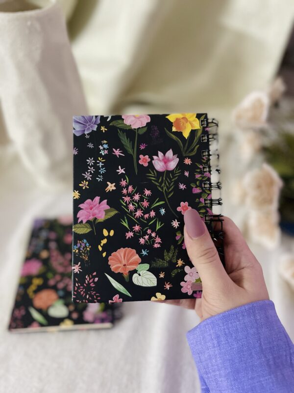 Wildflowers on black Notepad